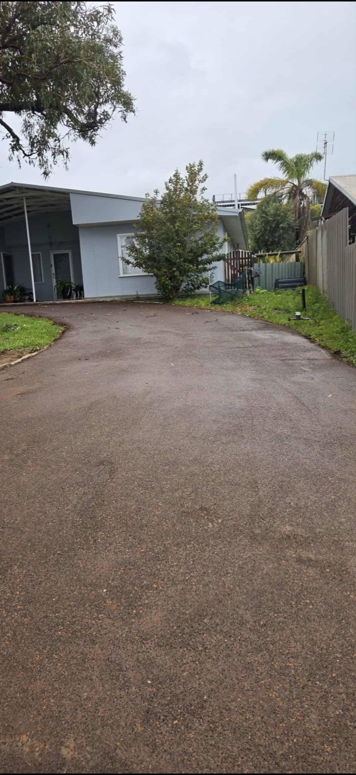 Freshly laid bitumen road with clean lane markings