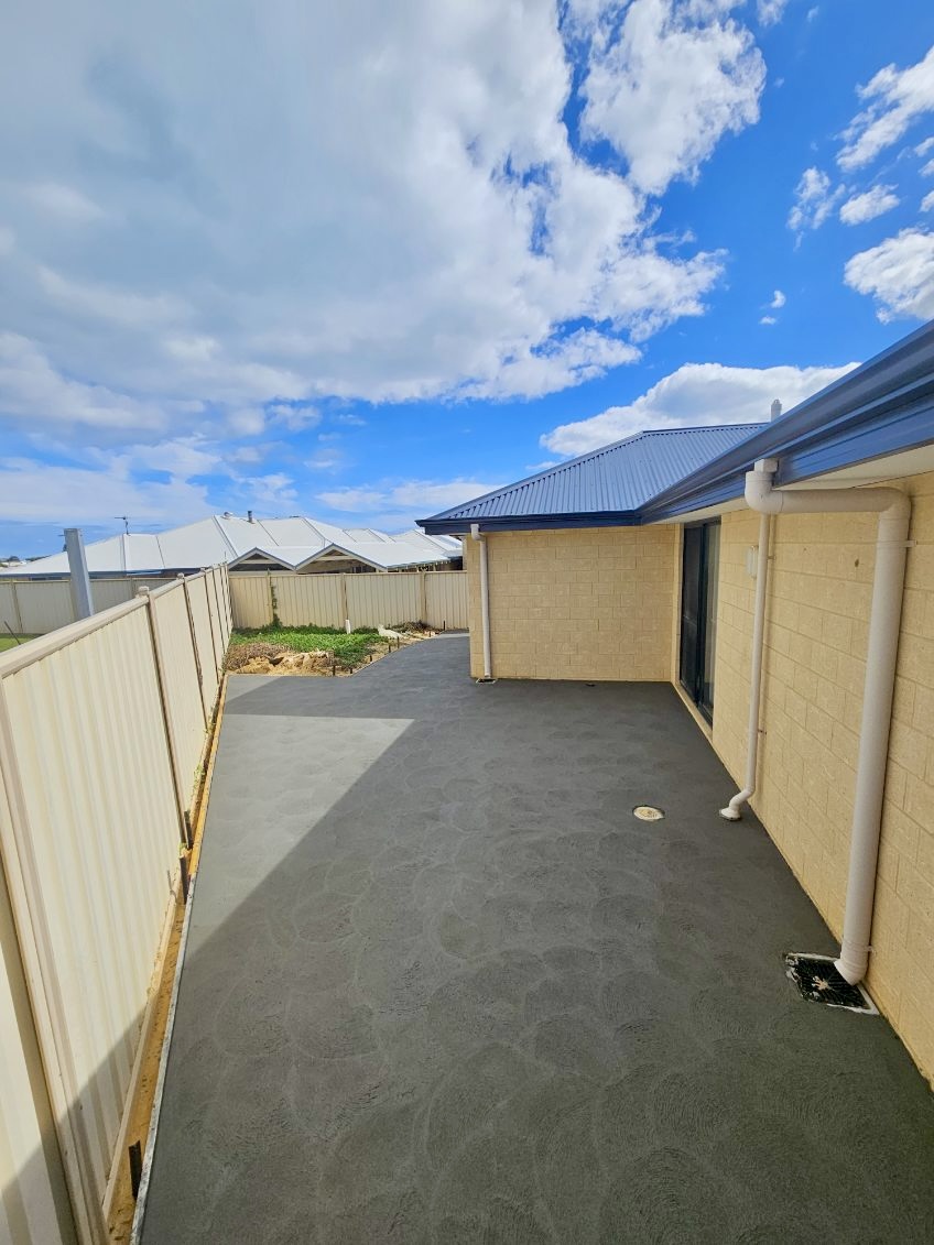 Reconstituted concrete patio with native landscaping